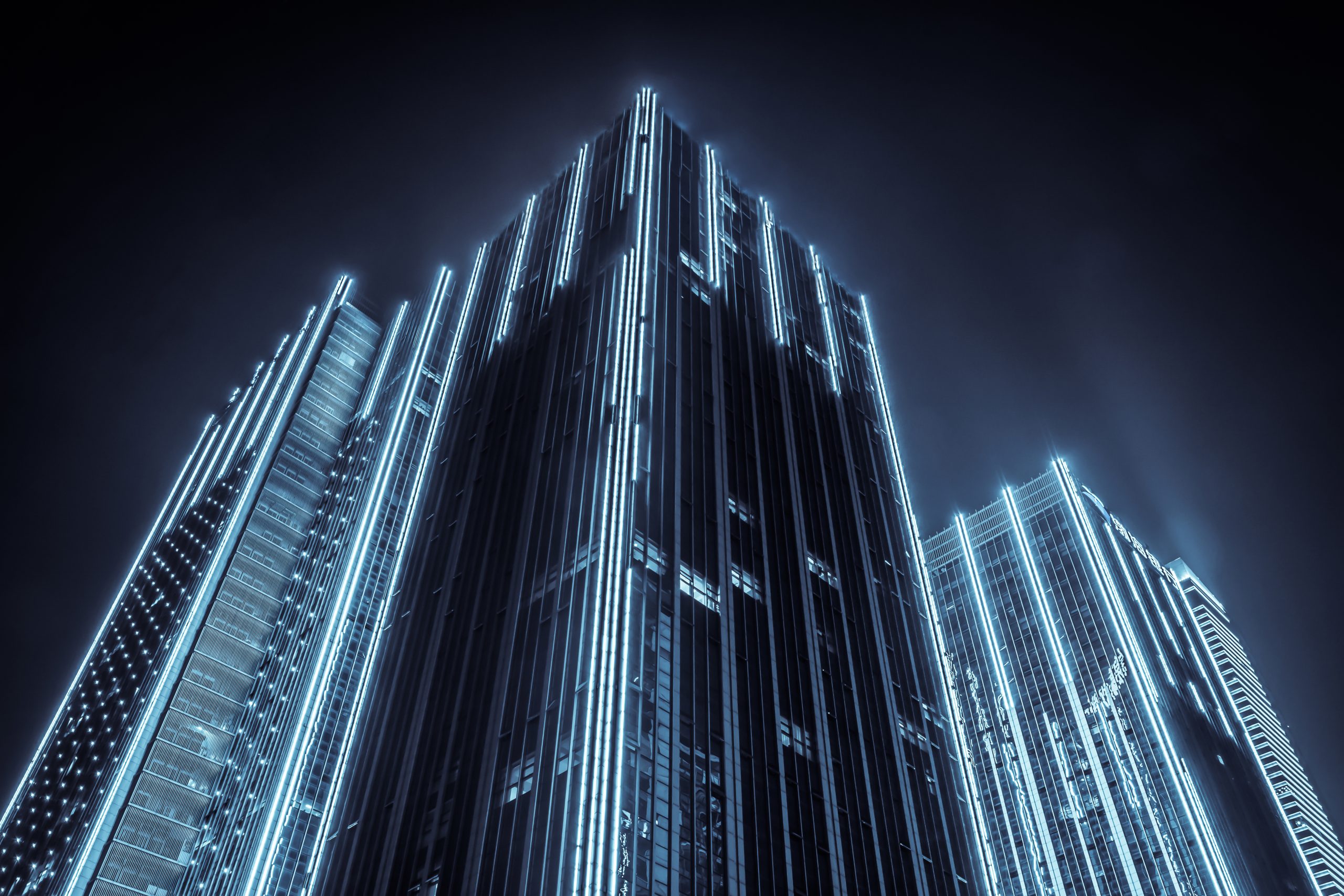 Illuminated city buildings at night